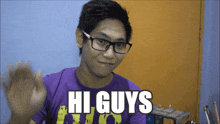 a young man wearing glasses and a purple shirt that says hi guys