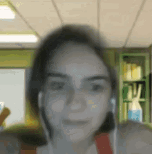 a blurry picture of a woman wearing ear buds