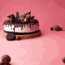 a cake with oreo cookies on top of it