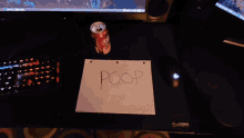a person is holding a piece of paper in front of a computer screen that says ' lenovo '