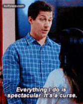 a man in a plaid shirt is talking to a woman and saying everything i do is spectacular it 's a curse