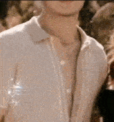 a close up of a man wearing a white shirt .