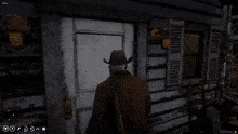 a man in a cowboy hat stands in front of a door in a game