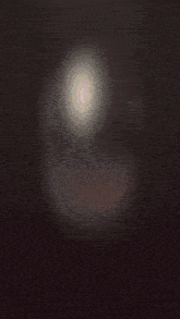 a painting of a sphere with a few pieces of glass floating around it