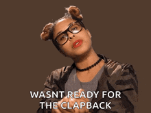 a woman wearing glasses and a choker is saying wasnt ready for the clapback