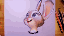a drawing of judy hopps from zootopia is on a wooden table
