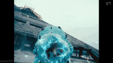 an aespa gif is shown with a blue object in the background