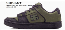 a pair of green and purple cricket waxed hemp and synthetic shoes