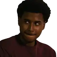 a man in a maroon shirt is making a face