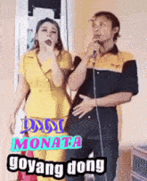a man is singing into a microphone next to a woman who is singing into a microphone ..