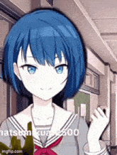 a girl with blue hair and blue eyes is standing in a hallway waving her hand .