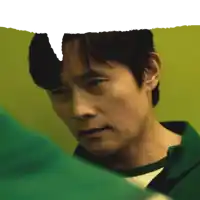 a close up of a man 's face with a speech bubble above his head
