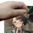 a hand is holding a piece of paper with a picture of a girl in a hat on it .