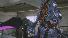 a robot with red eyes and a purple light coming out of it