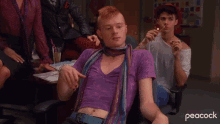 a man in a purple shirt and scarf says " why "