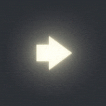 a white arrow pointing down in the dark