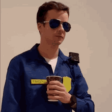 a man in a blue uniform has a sticker on his chest that says 999tcl