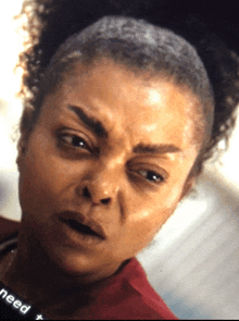 a close up of a woman 's face with the word need visible in the corner