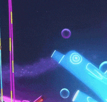 a person is standing in front of a stage with a bunch of neon lights .