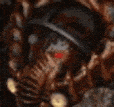 a close up of a person 's face with red eyes and a helmet .