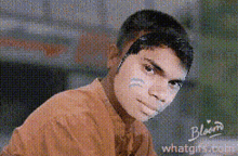 a pixelated image of a young man with the word bloom on the bottom right