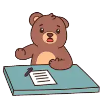 a brown teddy bear sits at a desk with a pen and a piece of paper