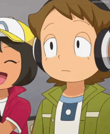 a cartoon boy wearing headphones is standing next to a girl wearing a baseball cap .