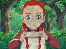 a girl with red hair and braids is holding a piece of paper