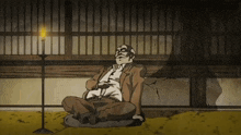 a cartoon of a man sitting on the ground with a candle in the background
