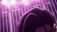 a close up of a person 's head with purple lights behind him