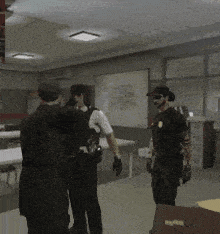a group of police officers standing in a room