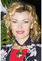 a woman wearing a choker and a necklace with an owl pendant