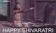 a little girl is sitting on the ground with her arms outstretched and the words `` happy shivaratri '' written on the bottom .