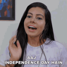 a woman says " aaj independence day hain " in a purple shirt