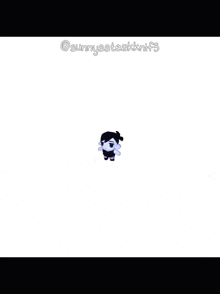 a black and white stuffed animal with the name sunnyssteakknifes written on the bottom