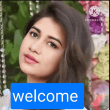 a woman 's face is behind a blue sign that says welcome