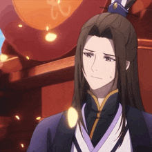a man with long hair is wearing a kimono and a blue hat
