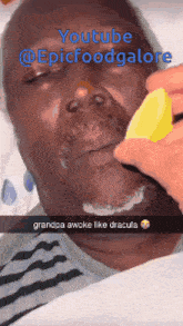 a man is laying in a hospital bed with a lemon in his mouth