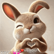 a rabbit is making a heart shape with its hands and says " king i love you "