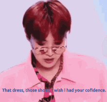 a man wearing glasses and a pink jacket says that dress those shoes i wish i had your confidence .