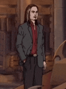a man with long hair and a beard wearing a suit and a red shirt