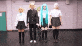 a group of people in cosplay are standing in a room .