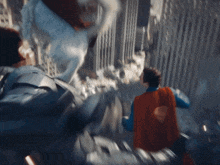a man in a superman cape is flying in the air