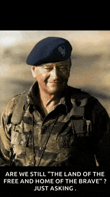 a man in a military uniform is smiling and says " are we still the land of the free and home of the brave just asking "