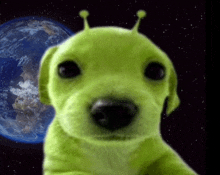 a green dog with antennas on its ears looks at the camera with the earth in the background
