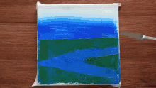 a person is using a spatula to paint a picture