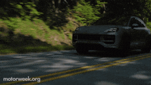 a car is driving down a road with motorweek.org written on the bottom right