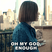 a woman standing on a balcony with the words oh my god enough