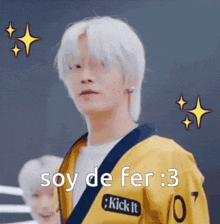 a man with white hair wearing a yellow jacket that says soy de fer 3