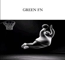 a black and white photo of a man jumping in the air with a basketball and the words green fn on the bottom